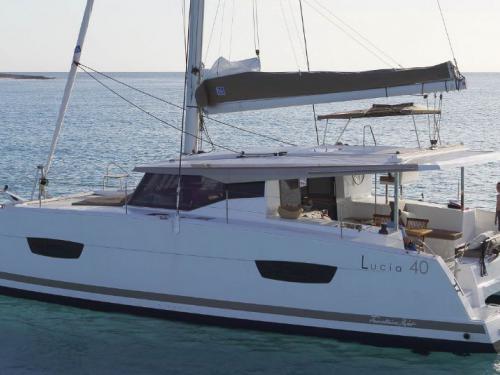 Catamaran Lucia 40 available for charter in City port of Marina