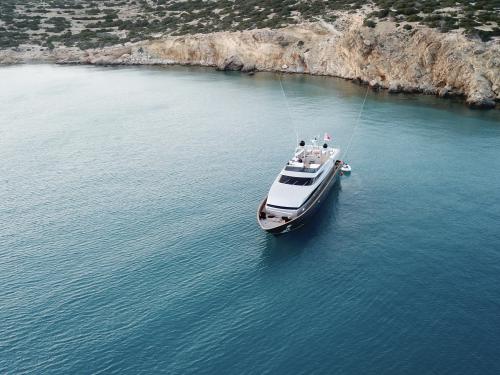 Motor yacht Baglietto 100 for rent in Ornos Marina